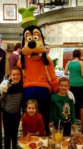 inventions disneyland paris three children stood with Goofy